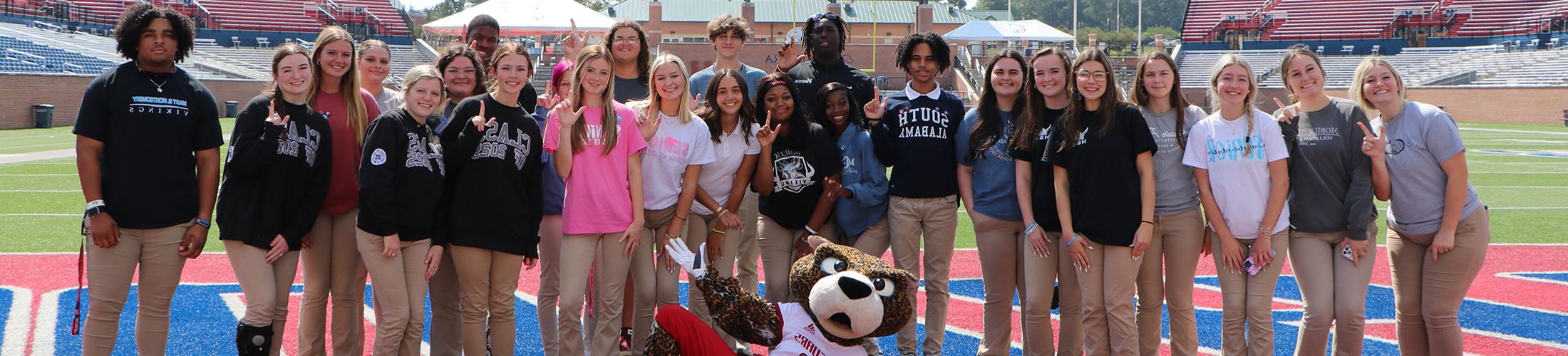 Start South students with Southpaw on the football field.