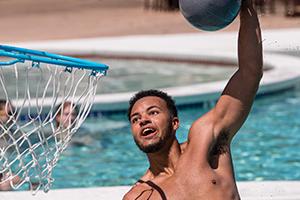 Student playing water basketball.