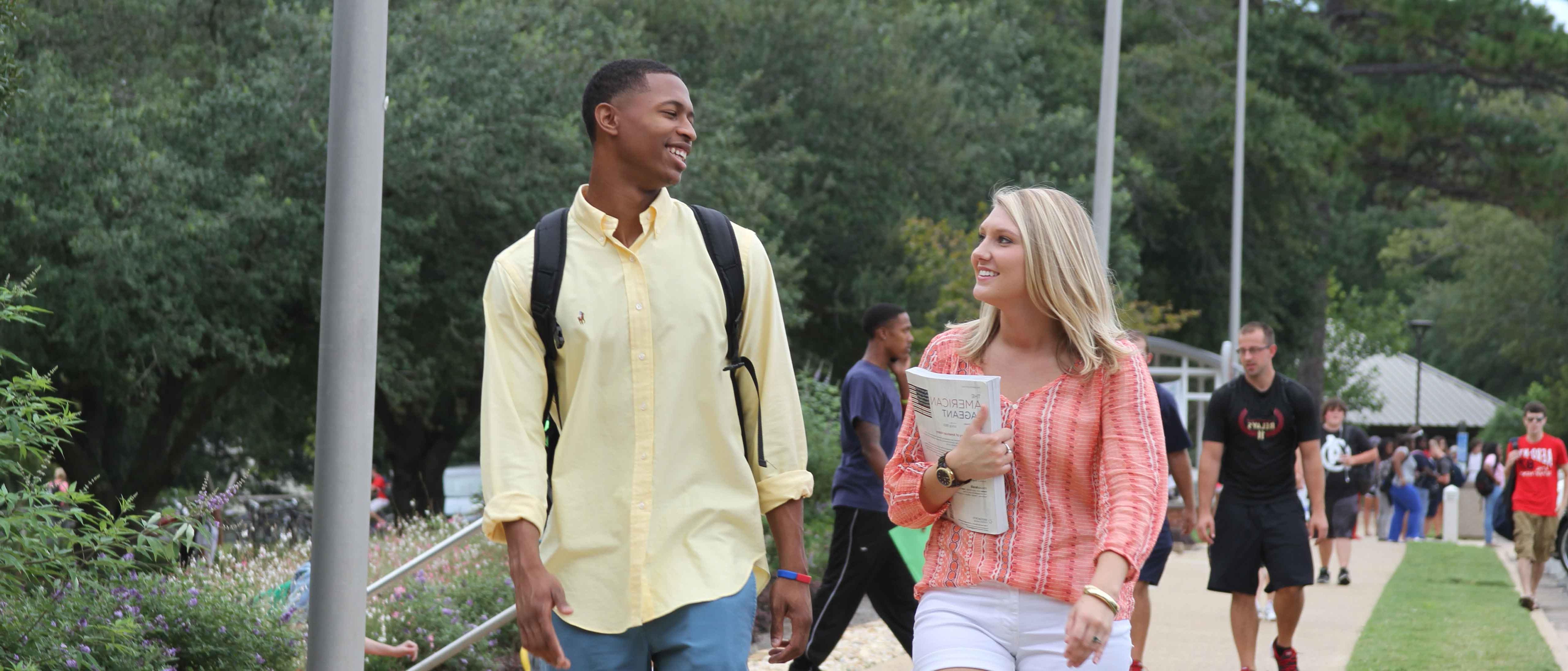 Students walking to class together, talking