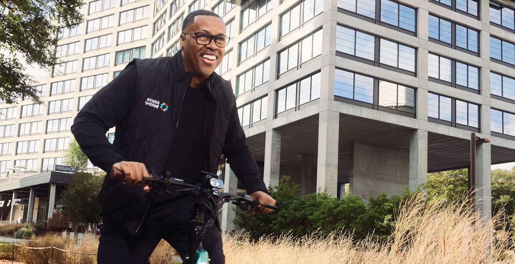 Clyde Higgs ’97, president and CEO of the Atlanta Beltline, bikes on the Beltline, one of the nation’s largest and most wide-ranging urban redevelopment programs.